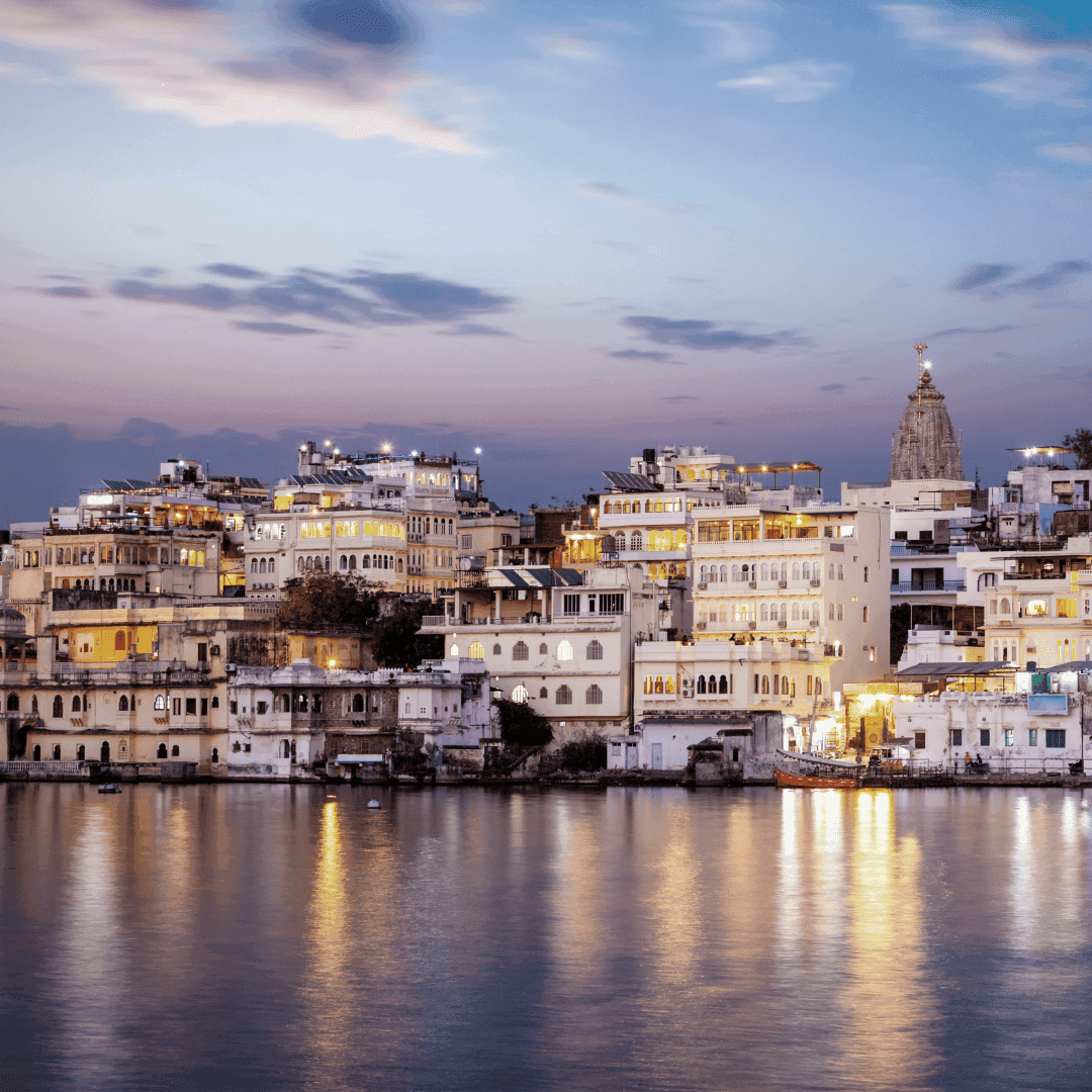 Evening view of Udaipur’s illuminated lakeside architecture, representing India’s evolving family office landscape and growing influence in wealth management