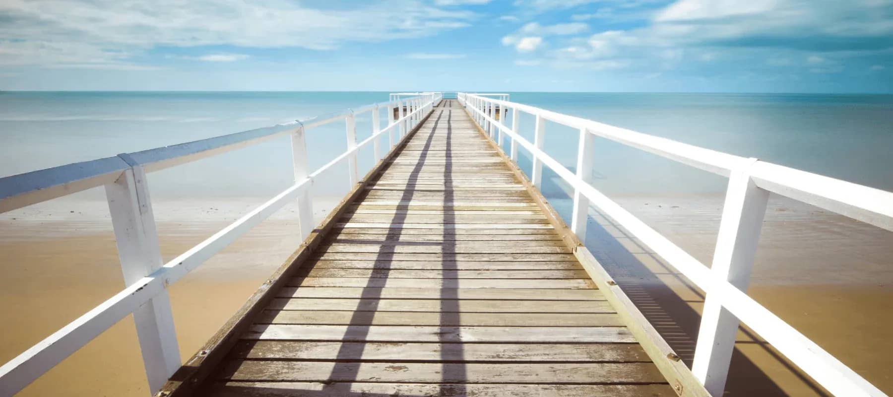 A paperless family office, a wooden jetty running out over calm water.