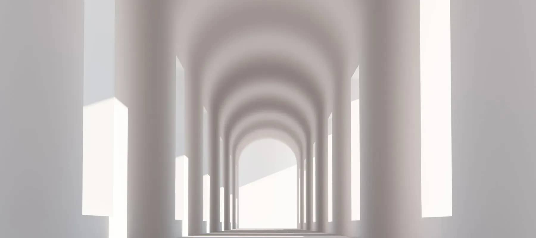 Family office estate management, a colonnade of arches receding towards a bright opening at the end of the corridor.