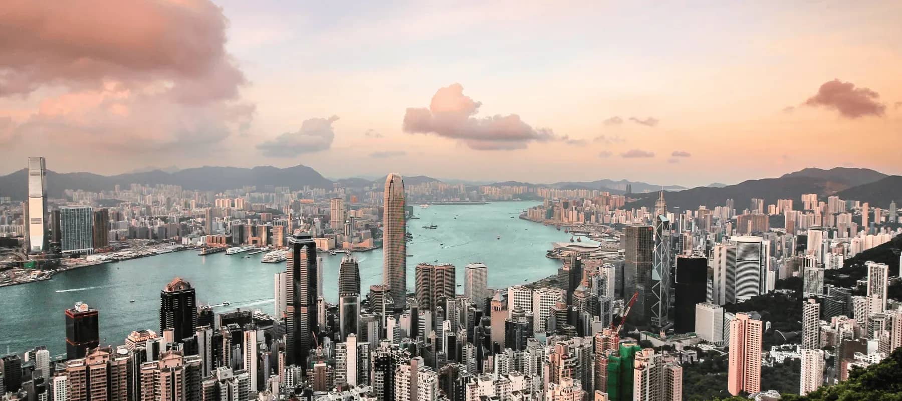 Hong Kong as a gateway, the Victoria Harbour skyline at dusk.