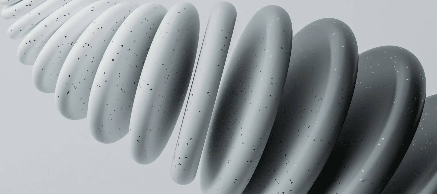 Multi-family office expectations, coiled grey tubular forms in a repeating spiral.