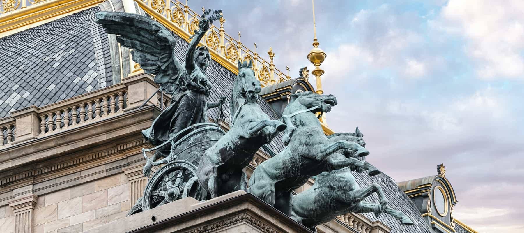 Multi-family office versus wealth manager, a bronze equestrian statue against a bright sky.