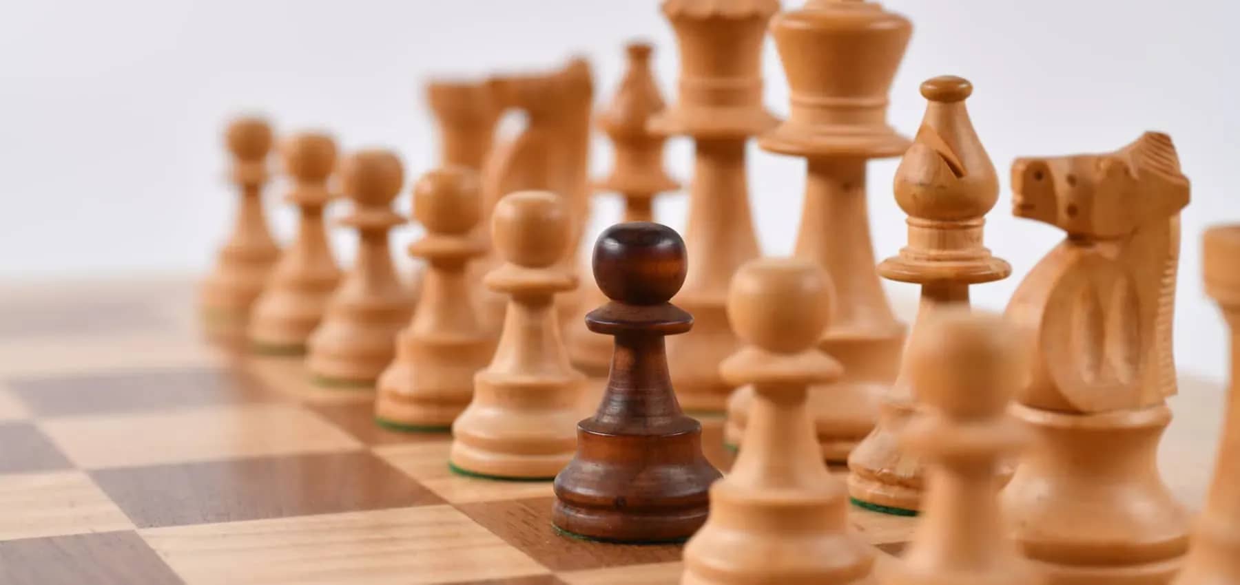 Single versus multi-family office, a single dark pawn among pale chess pieces.