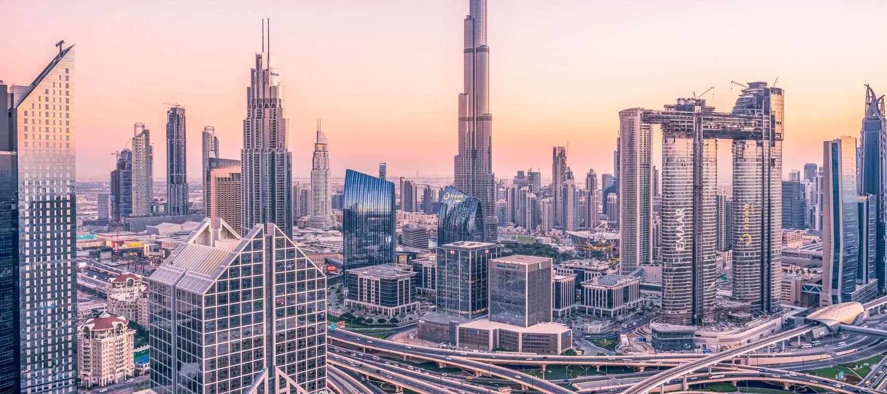 Family offices in the UAE, the Dubai skyline at dusk.