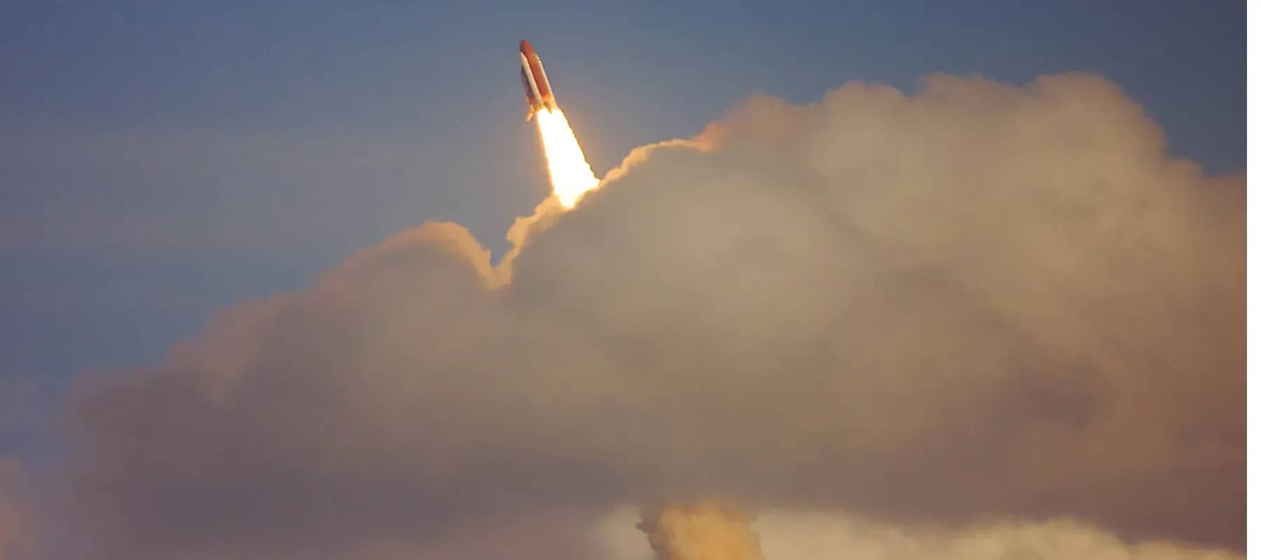 Venture investing, a rocket climbing through cloud on a trail of flame.