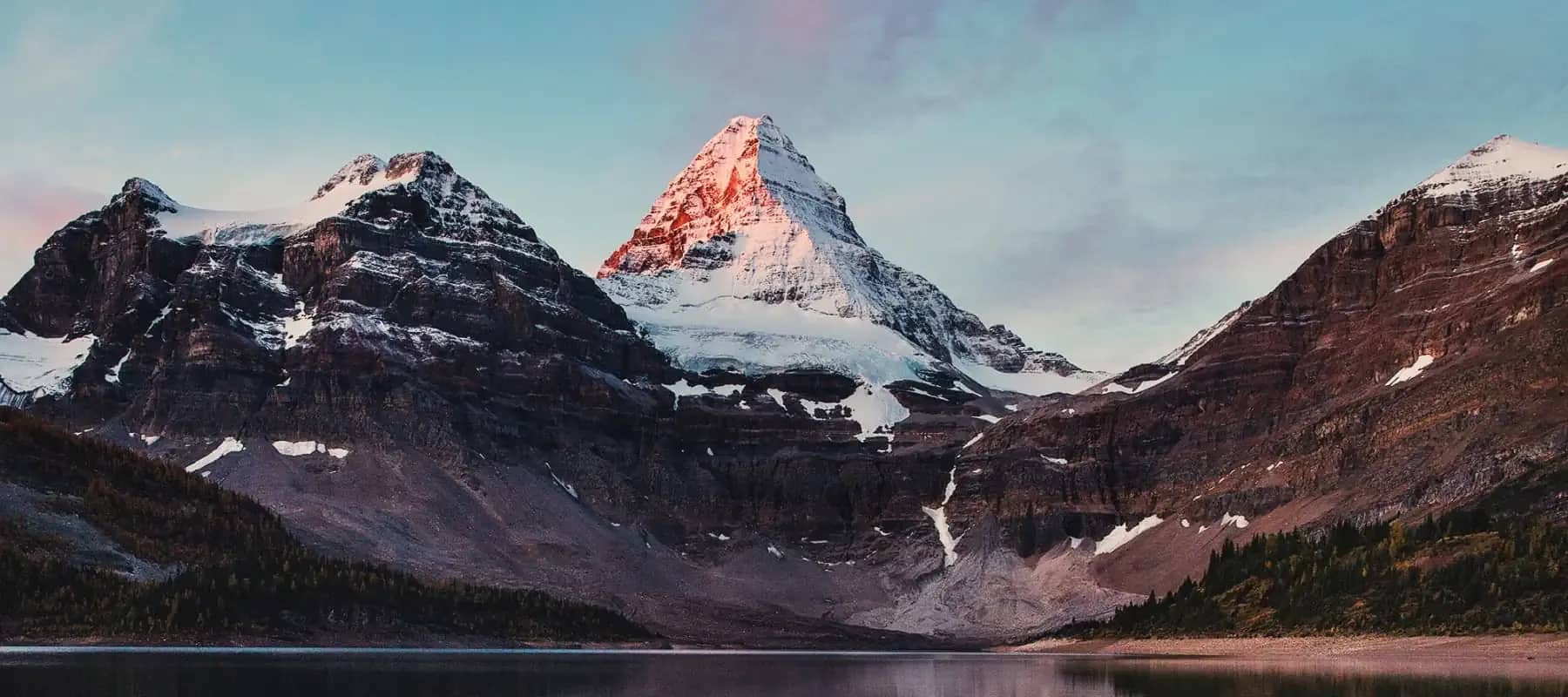 Venture philanthropy, snow-capped mountain peaks catching alpine light.