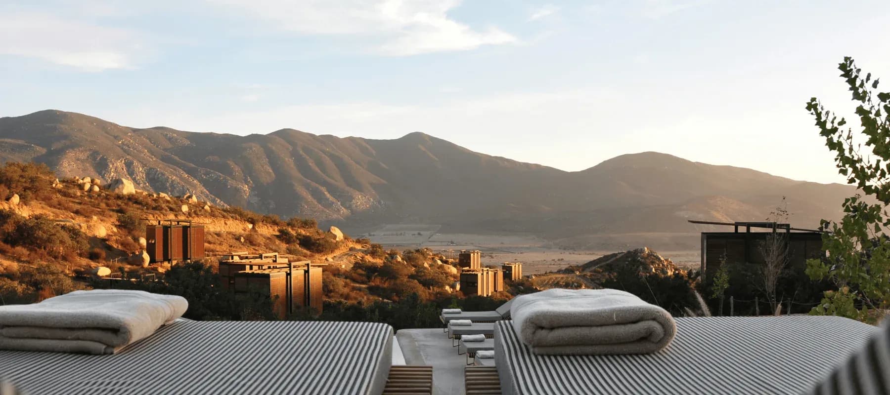 Concierge solutions, a low building complex set in an arid mountain valley.