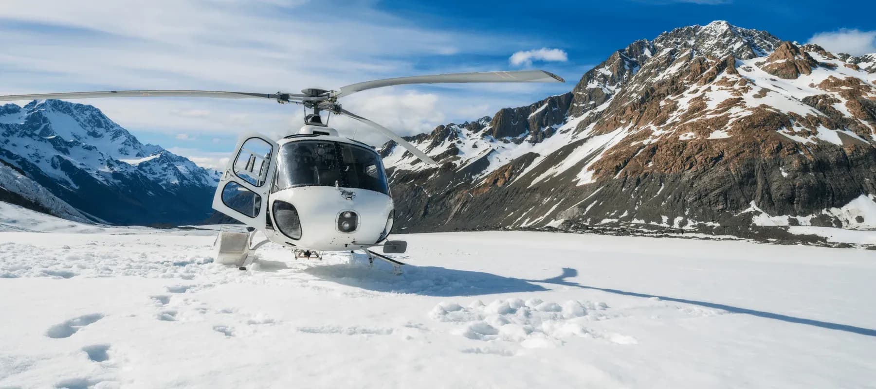 Healthcare and security preparedness, a helicopter standing on a snow-covered mountain.