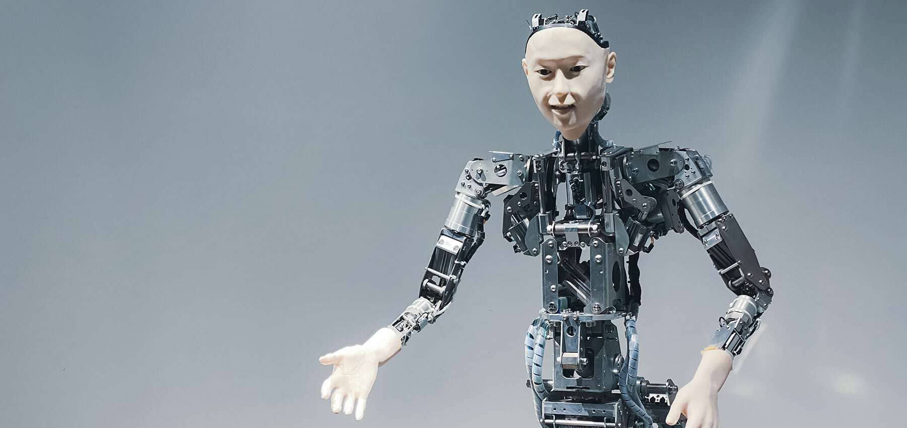 Trust and networks in the family office, a humanoid robot with exposed mechanical arms.
