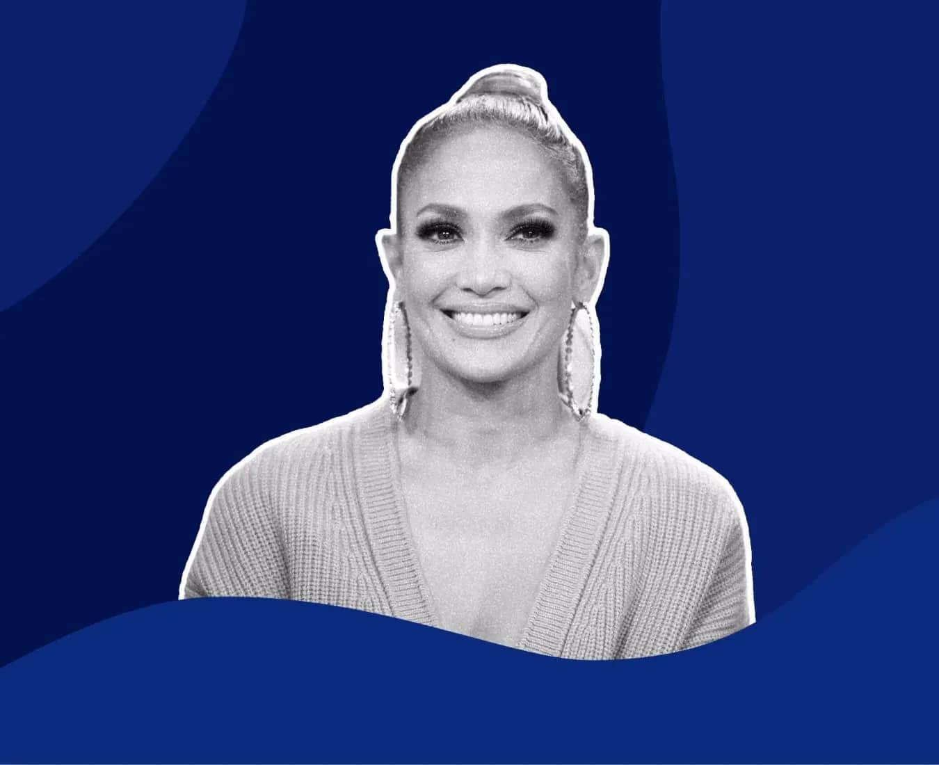 Jennifer Lopez wealth, a monochrome portrait of Jennifer Lopez smiling in large hoop earrings against a deep navy background.