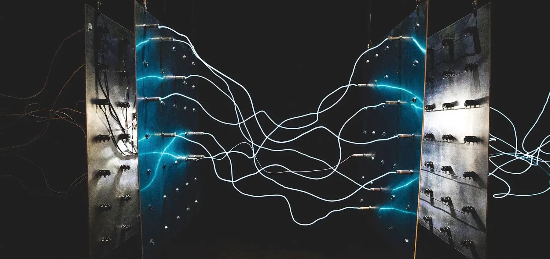 Cryptocurrency and family offices, glowing blue cables snaking across dark metal panels.