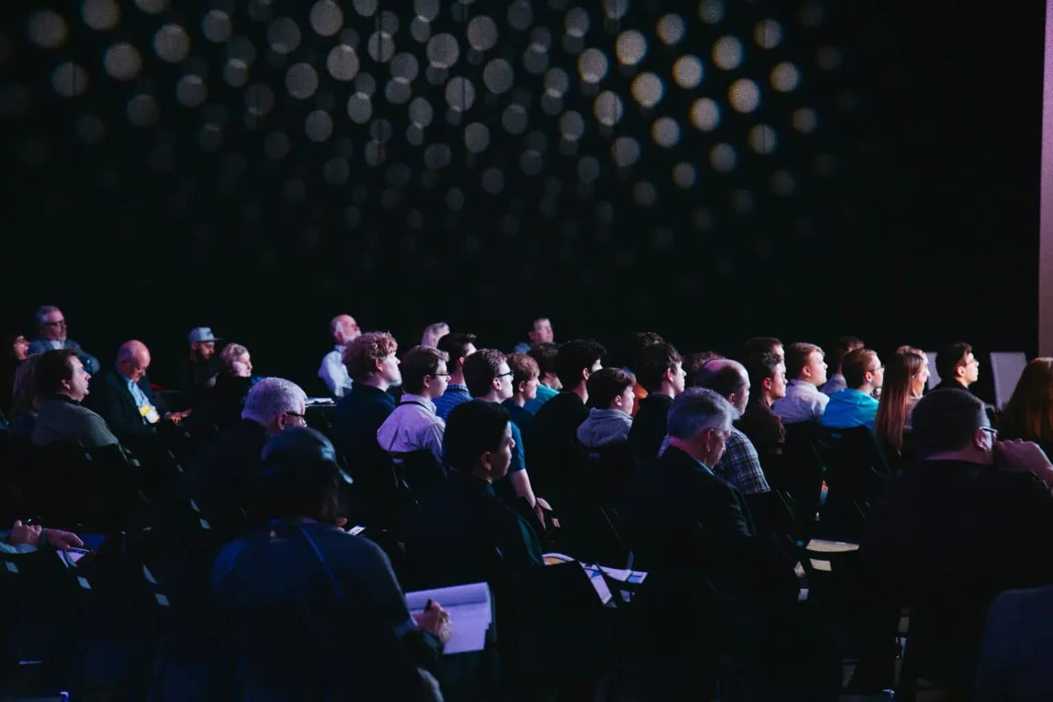 Marketing to family offices, an audience seated in a darkened auditorium.