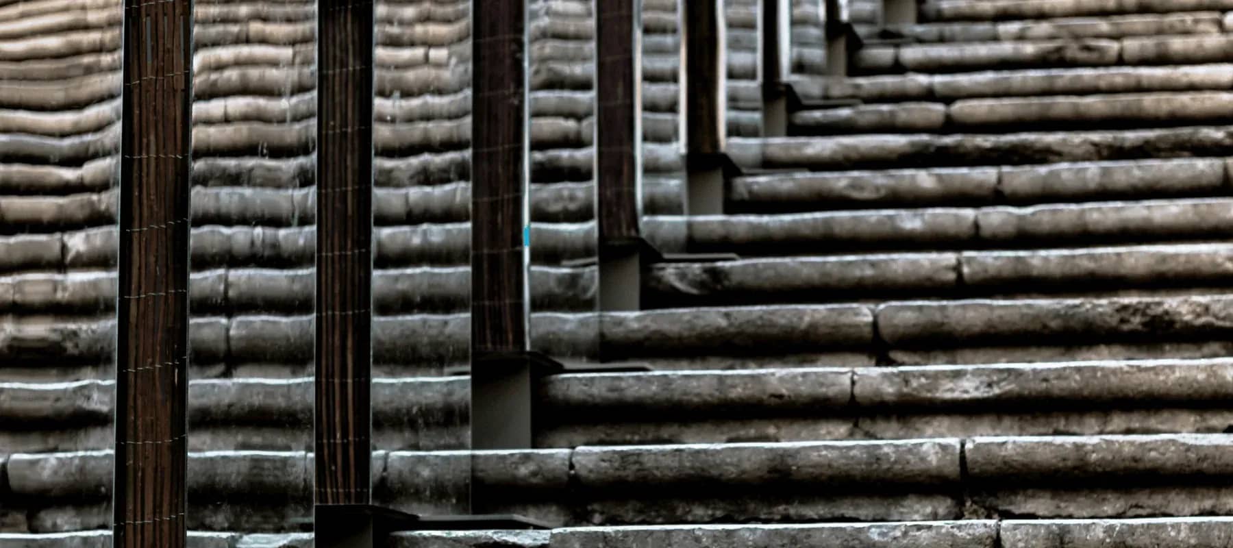 Building an AI strategy, a wall of stacked stone and timber in close texture.