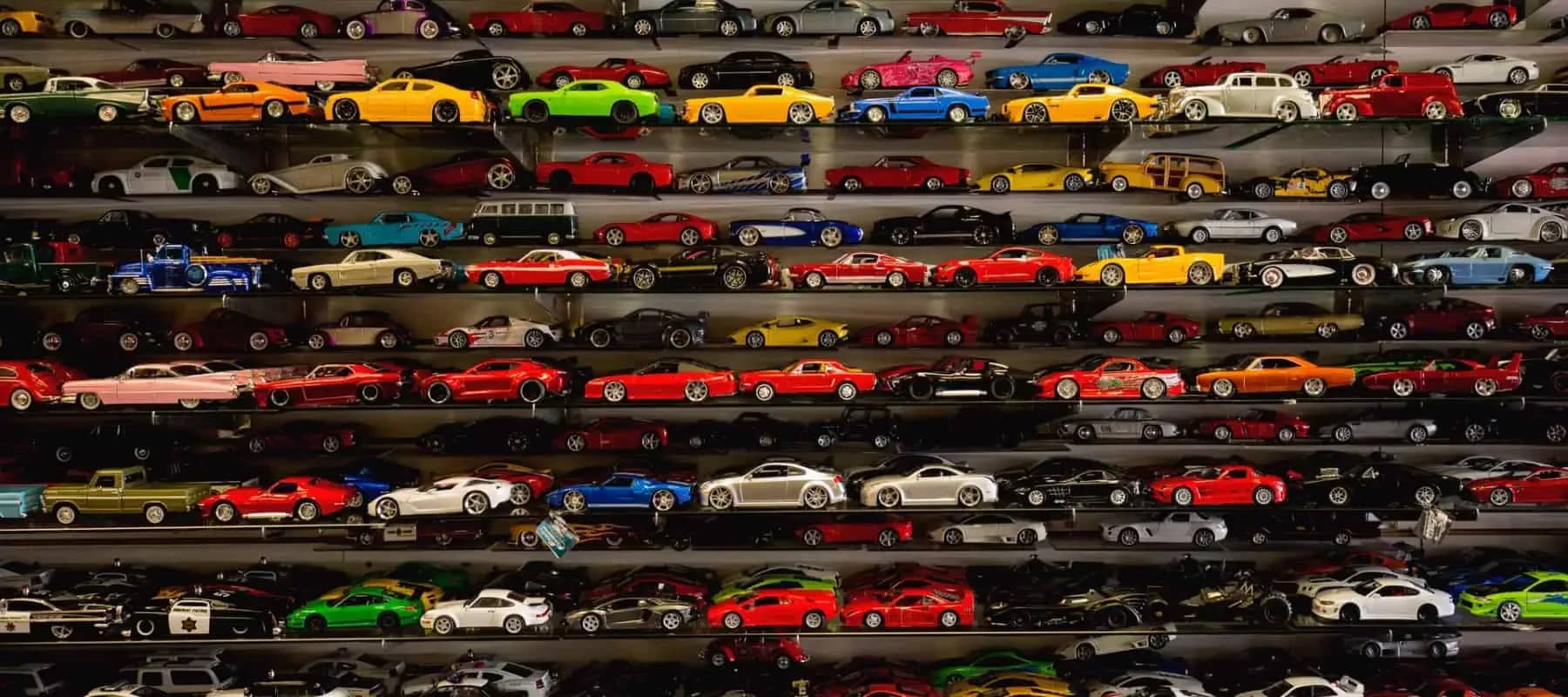 Luxury as an asset class, shelves packed with brightly coloured model cars.